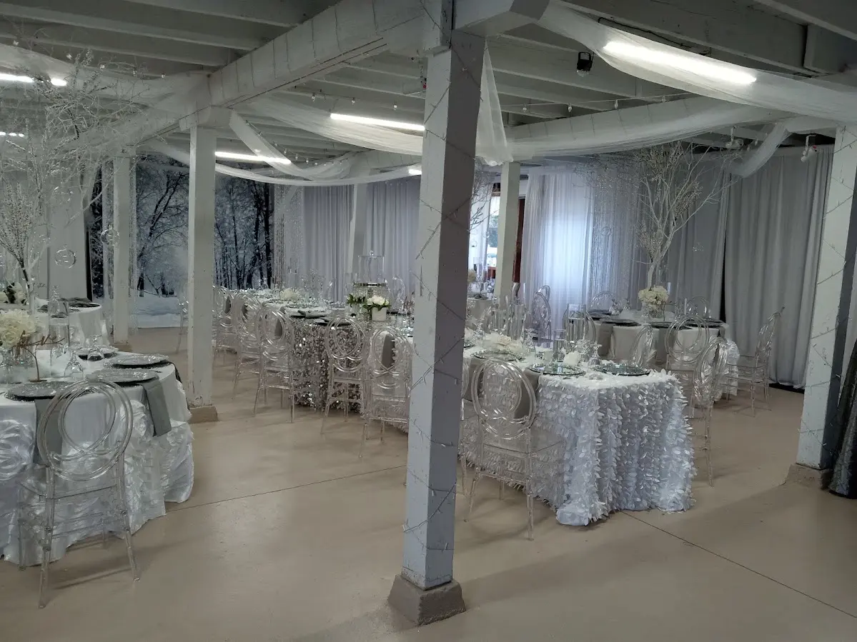 A picture of a silver piece decorated table and chairs